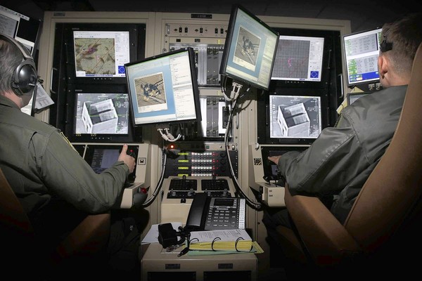 Personnel at March Air Reserve Base control a Predator drone (Don Bartletti, LA Times)